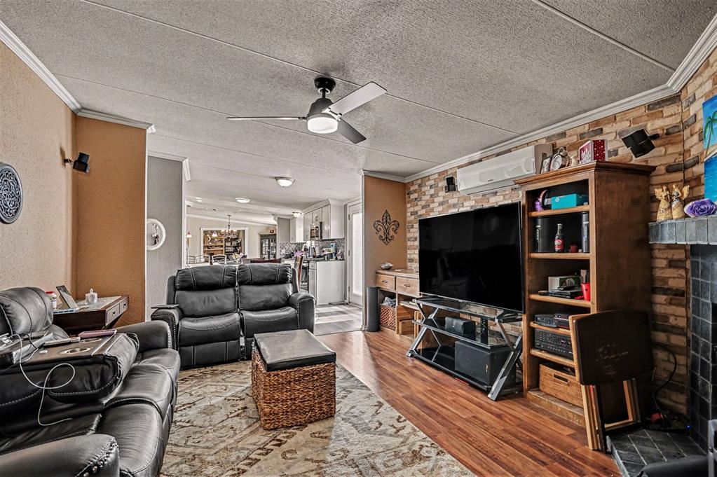 21664 Highway 34 Terrell, TX 75161 - Photo 16 of 34 a living room with furniture and a flat screen tv