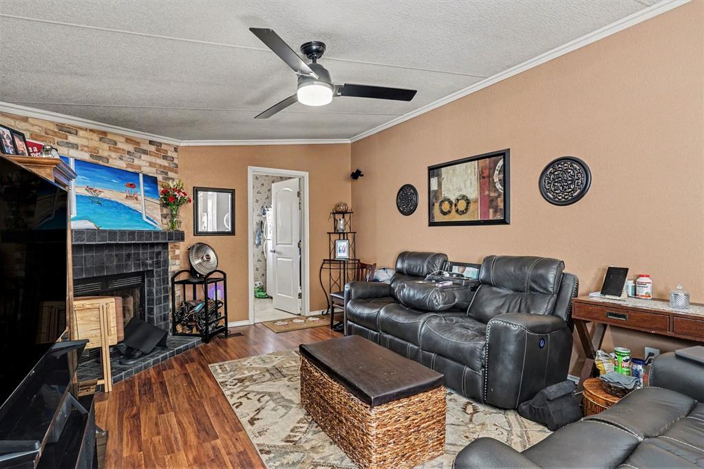 21664 Highway 34 Terrell, TX 75161 - Photo 17 of 34 a living room with furniture and a flat screen tv