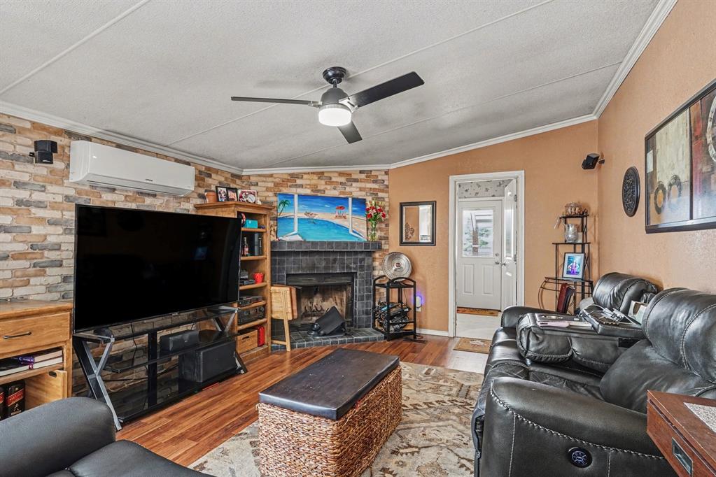 21664 Highway 34 Terrell, TX 75161 - Photo 18 of 34 a living room with furniture and a flat screen tv