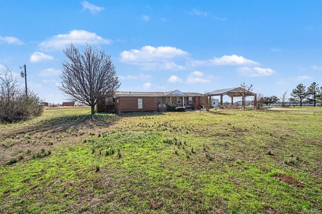 21664 Highway 34 Terrell, TX 75161 - Photo 2 of 34 a view of a house with a yard
