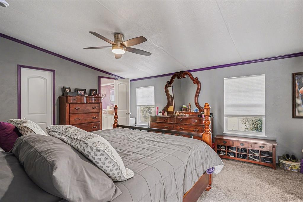 21664 Highway 34 Terrell, TX 75161 - Photo 21 of 34 a bedroom with a bed dresser and a window