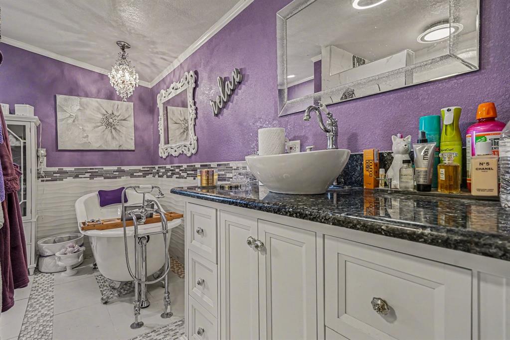 21664 Highway 34 Terrell, TX 75161 - Photo 22 of 34 a bathroom with a granite countertop sink and a mirror