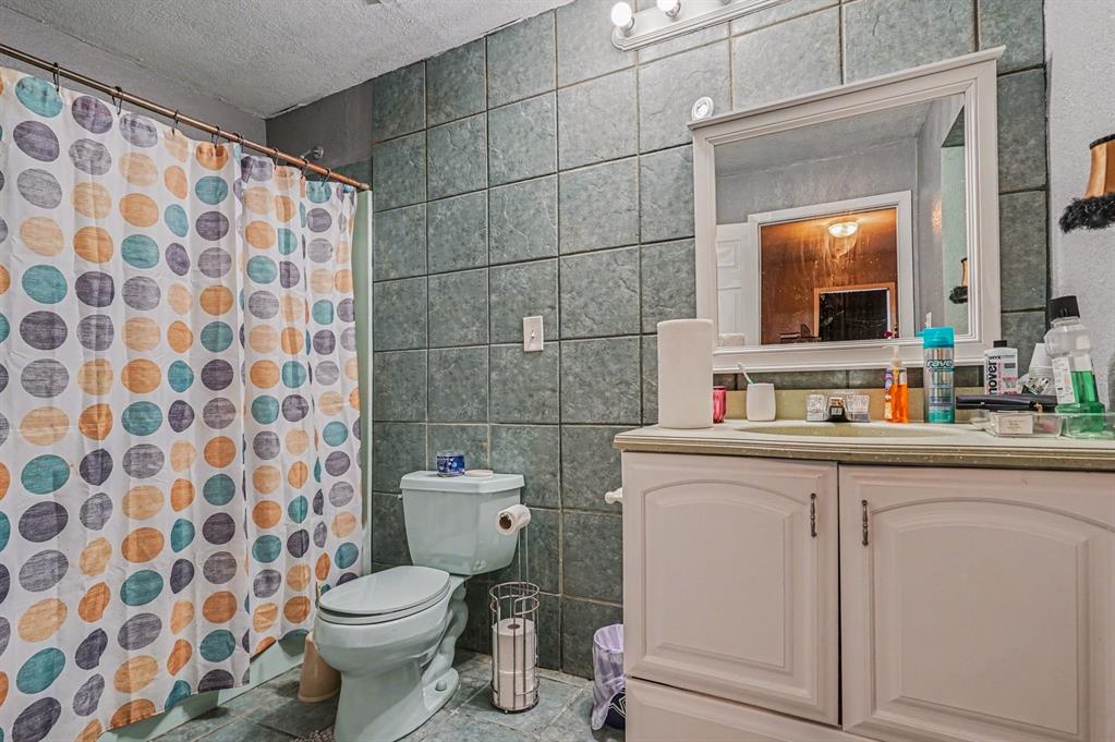 21664 Highway 34 Terrell, TX 75161 - Photo 24 of 34 a bathroom with a toilet and a sink