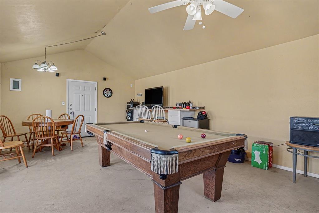 21664 Highway 34 Terrell, TX 75161 - Photo 28 of 34 a view of a dining room with furniture and a chandelier