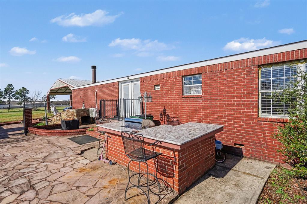 21664 Highway 34 Terrell, TX 75161 - Photo 30 of 34 a outdoor space with patio furniture