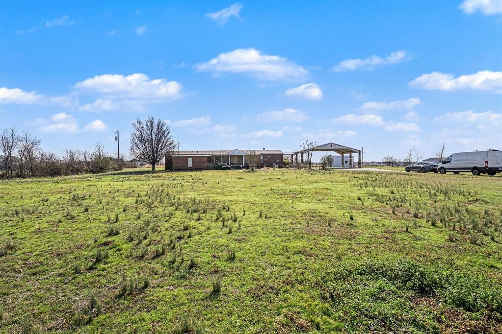 21664 Highway 34 Terrell, TX 75161 - Photo 3 of 34 a view of a large body of water with lots of green space and fog