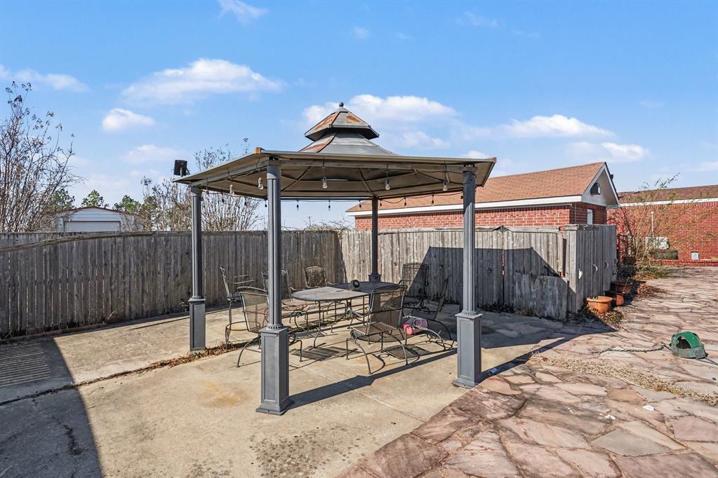 21664 Highway 34 Terrell, TX 75161 - Photo 32 of 34 a view of a patio with a table and chairs