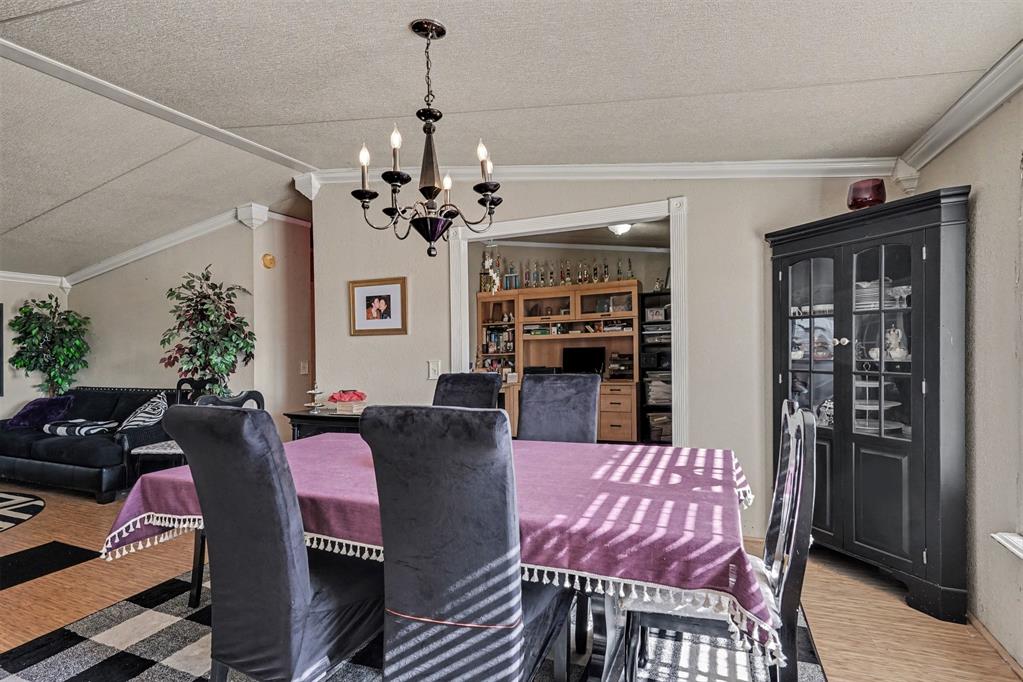 21664 Highway 34 Terrell, TX 75161 - Photo 8 of 34 a view of a dining room with furniture and chandelier