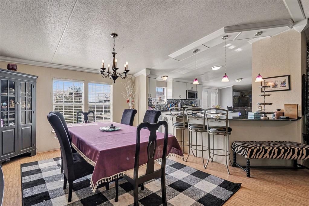 21664 Highway 34 Terrell, TX 75161 - Photo 10 of 34 a view of a dining room with furniture and a chandelier