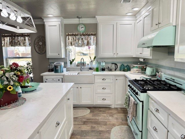 59 Private Road Dayton, TX 77535 - Photo 4 of 13 a kitchen with kitchen island a sink stove and cabinets