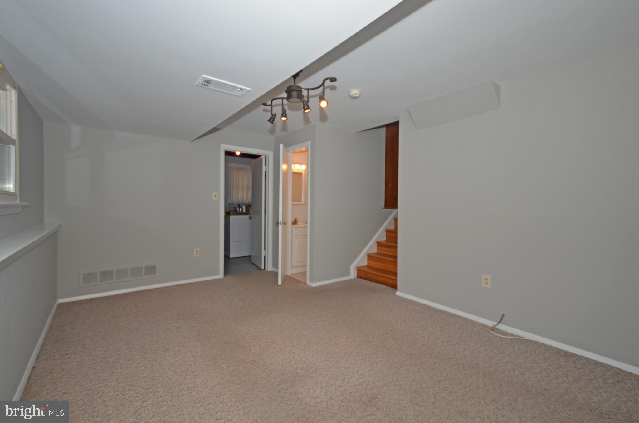 9662 Dundawan Road Baltimore, MD 21236 - Photo 36 of 50 Family room with view towards laundry area.