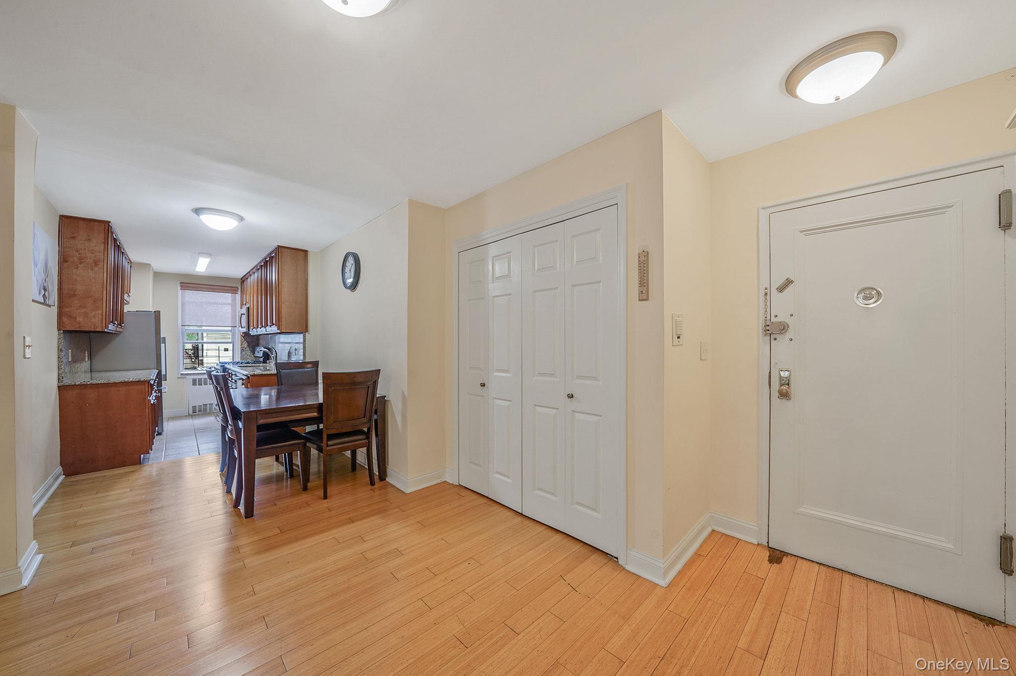 103-26 68th Avenue, Unit 2E Queens, NY 11375 - Photo 11 of 22 Entrance foyer featuring light wood-style flooring and baseboards