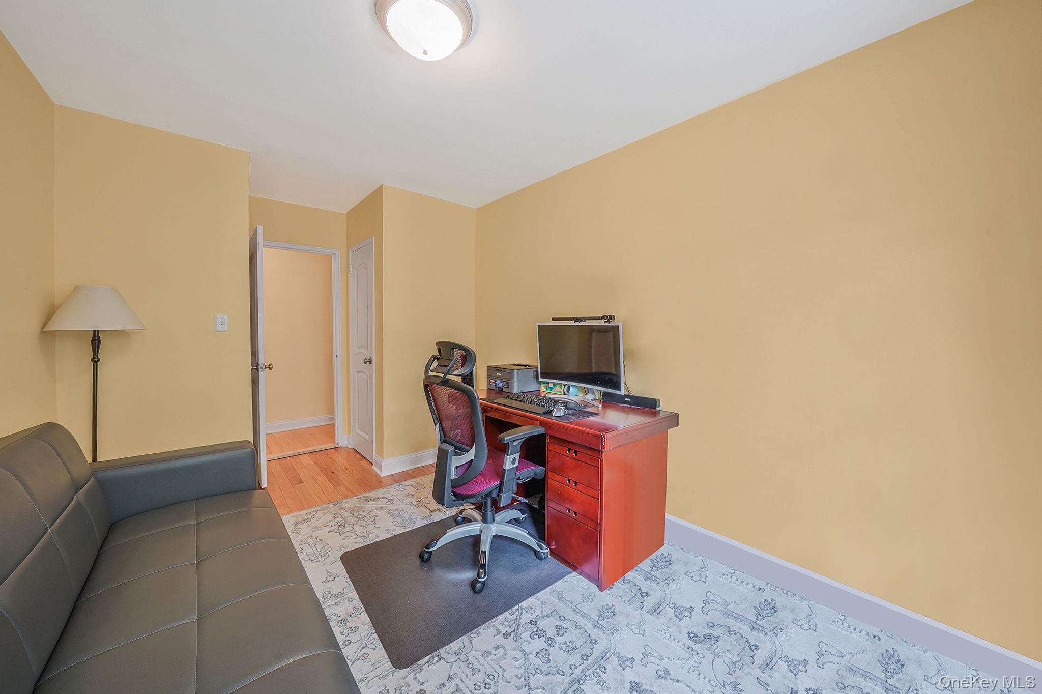103-26 68th Avenue, Unit 2E Queens, NY 11375 - Photo 18 of 22 Office featuring baseboards and wood finished floors