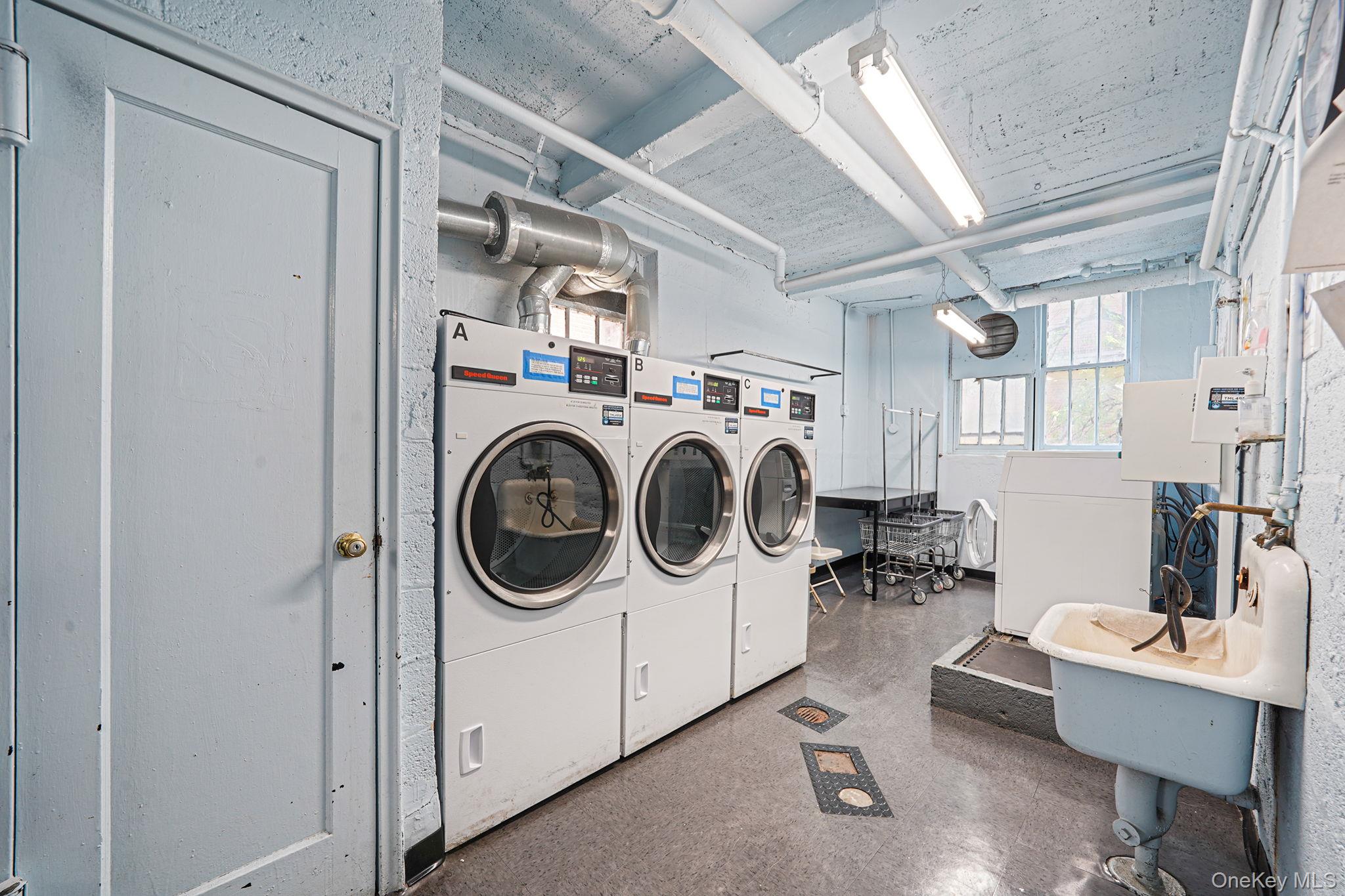 103-26 68th Avenue, Unit 2E Queens, NY 11375 - Photo 21 of 22 Community laundry with washer and clothes dryer