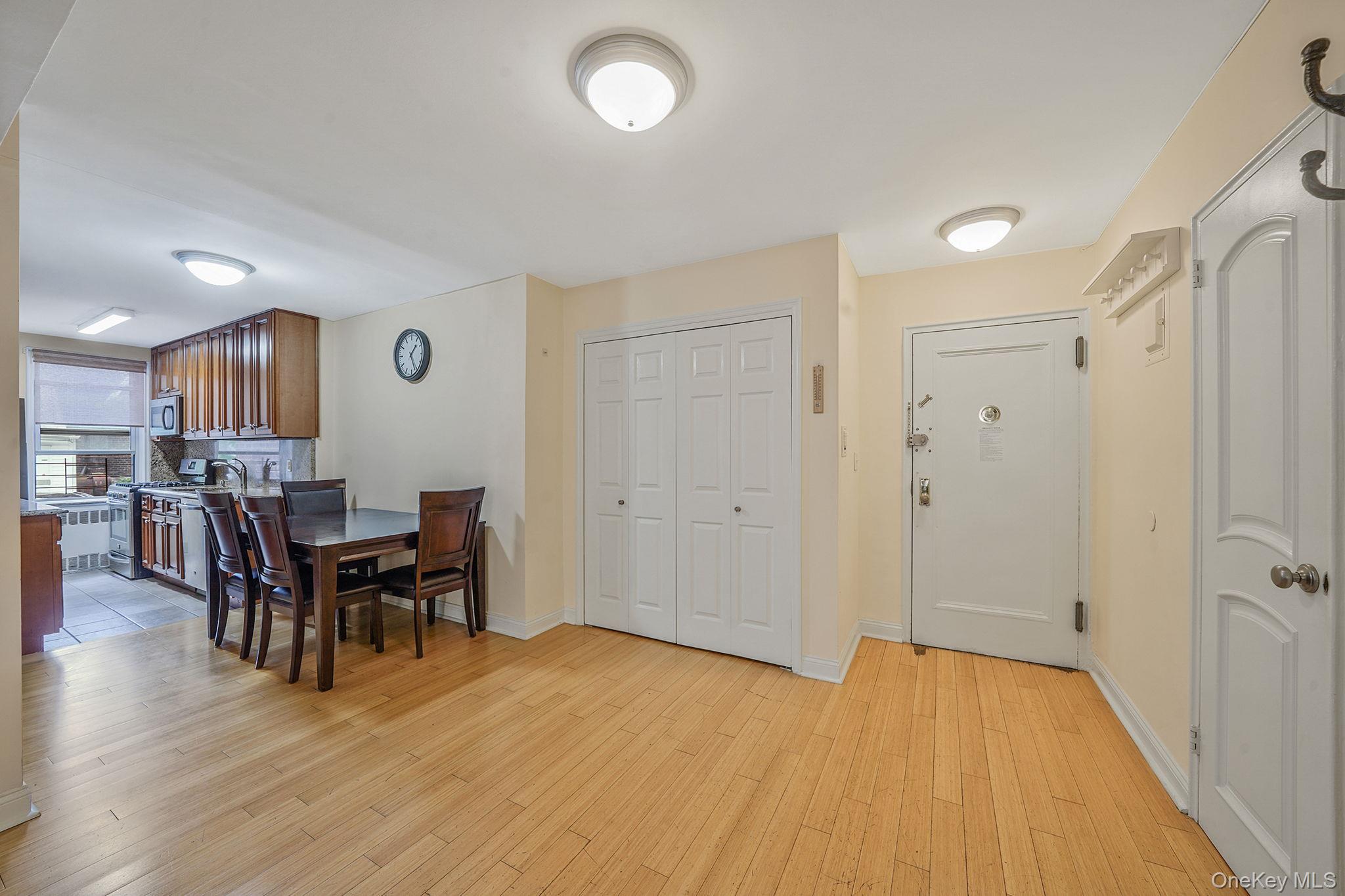 103-26 68th Avenue, Unit 2E Queens, NY 11375 - Photo 10 of 22 Dining room with light wood-style floors and baseboards