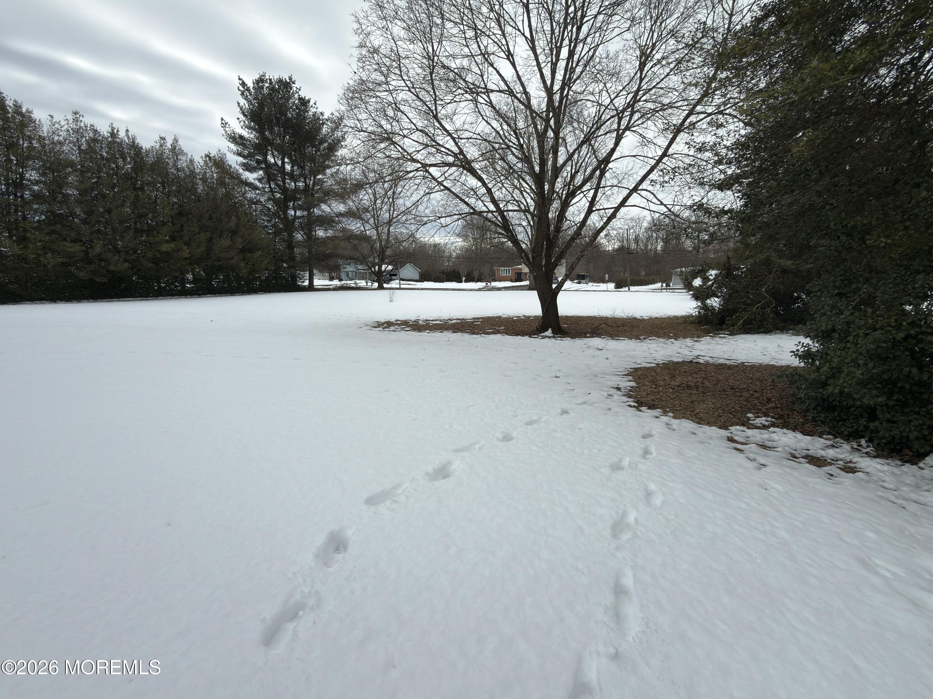 327 Sharon Road Hightstown, NJ 08520 - Photo 2 of 7 a view of snow on the side of road