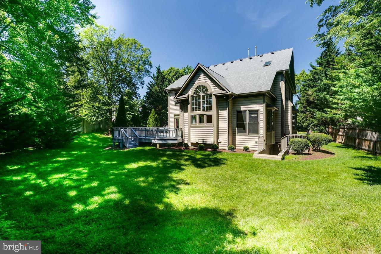 1489 Broadstone Place Vienna, VA 22182 - Photo 20 of 20 a front view of a house with a yard and porch