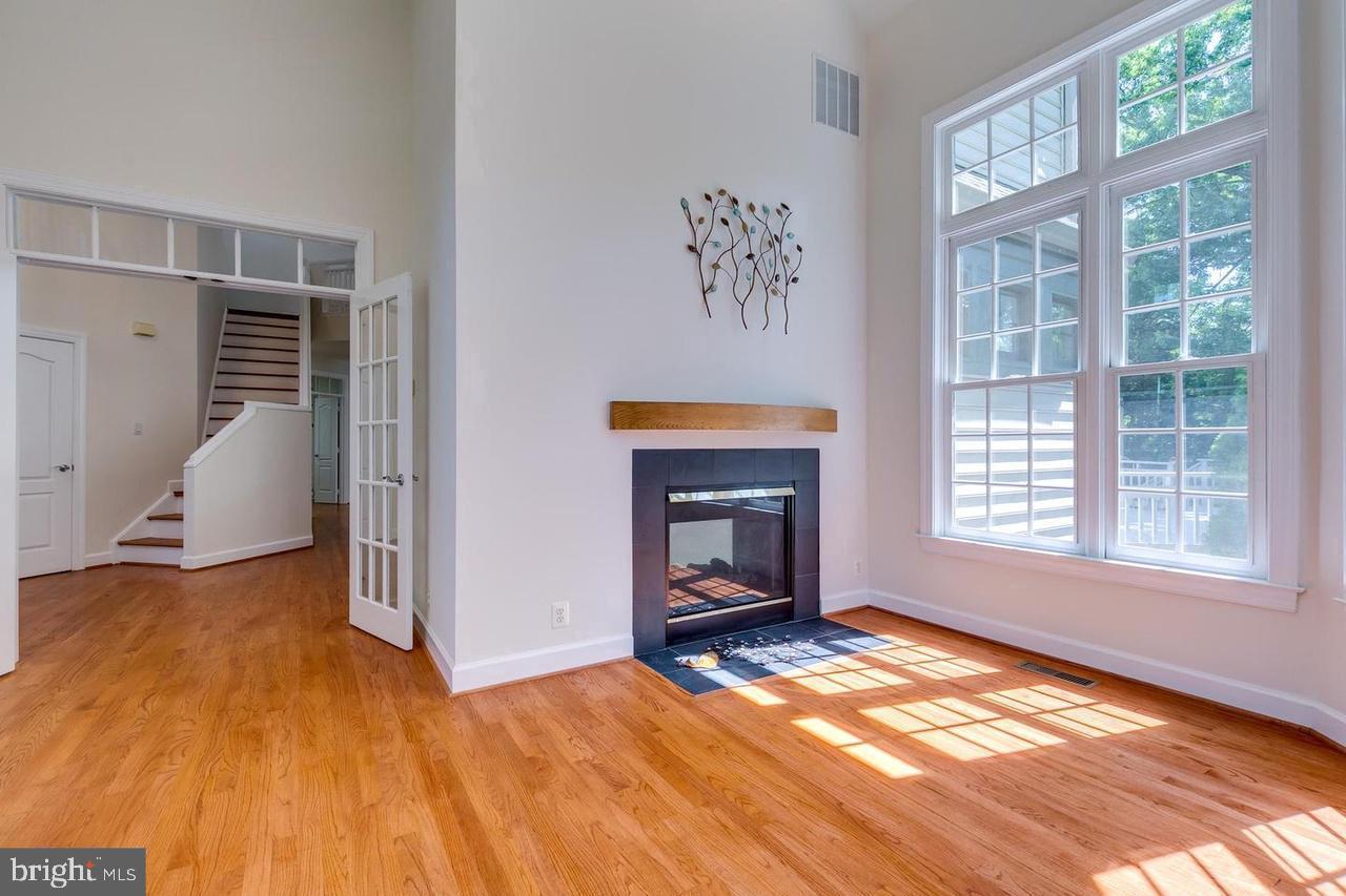 1489 Broadstone Place Vienna, VA 22182 - Photo 8 of 20 a view of an empty room with wooden floor and a window