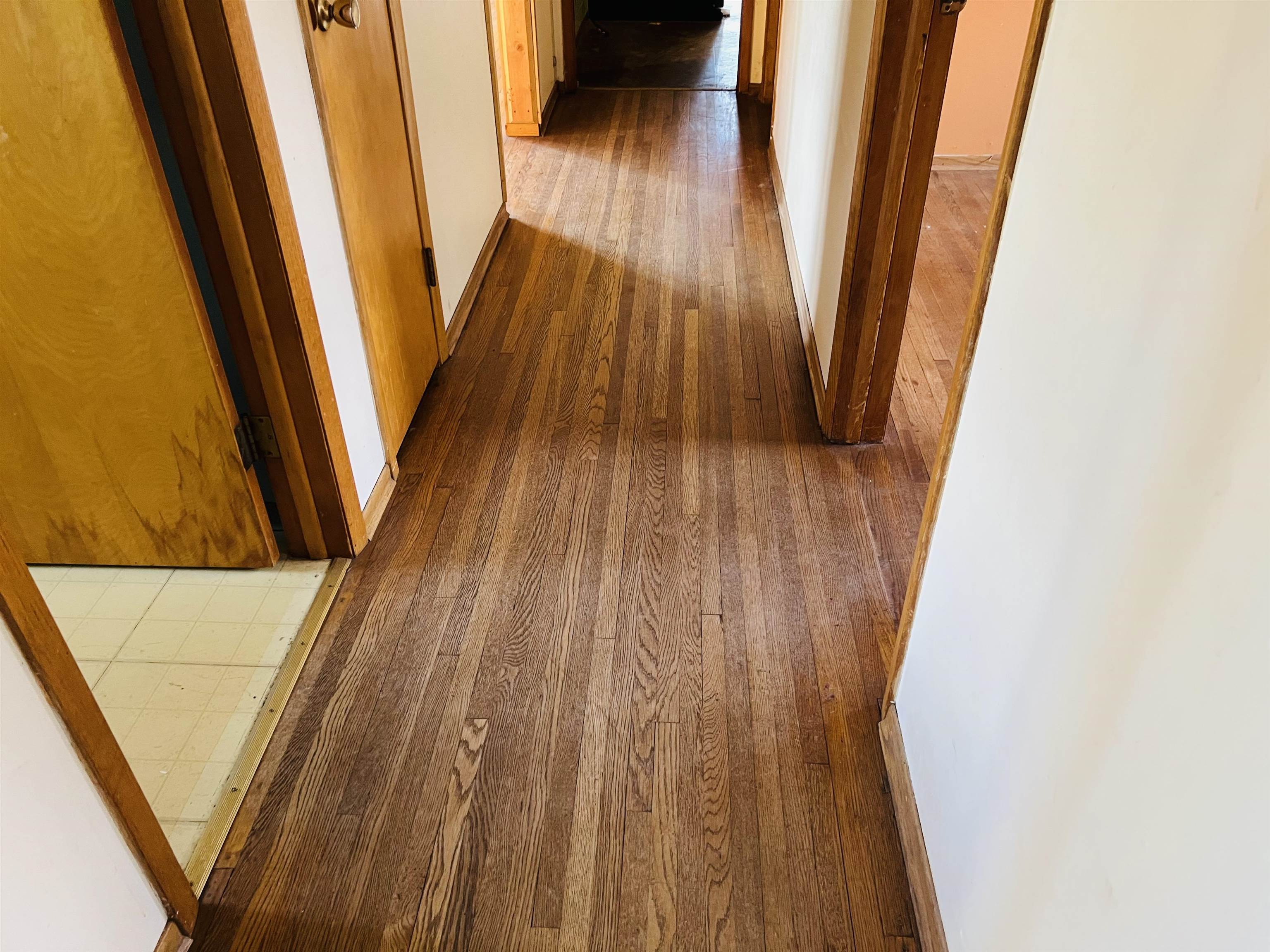 118 Rollins Ridge Tofte, MN 55615 - Photo 12 of 18 Hallway with dark wood finished floors and baseboards