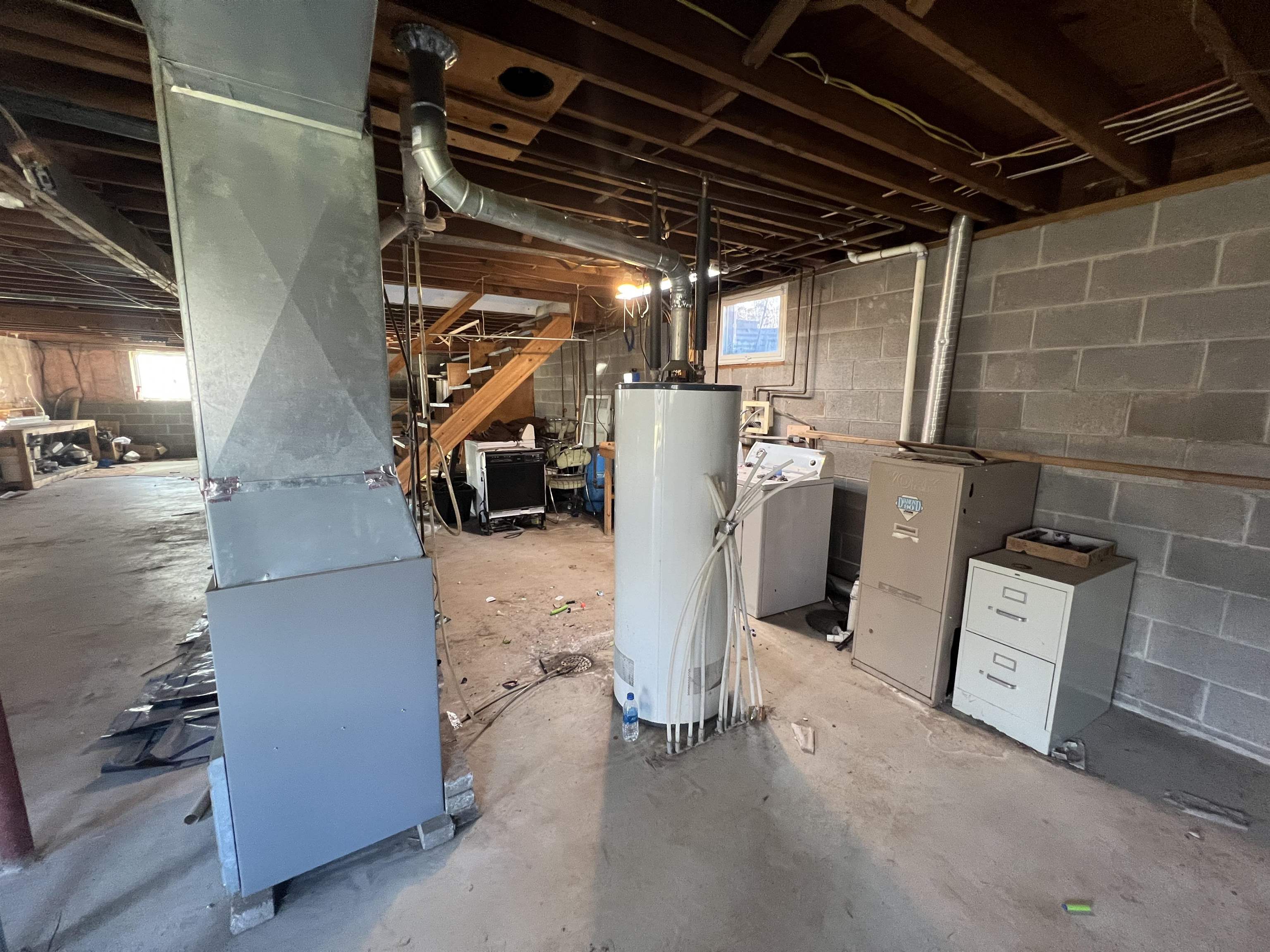 118 Rollins Ridge Tofte, MN 55615 - Photo 13 of 18 Basement with water heater, washer / dryer, and heating unit