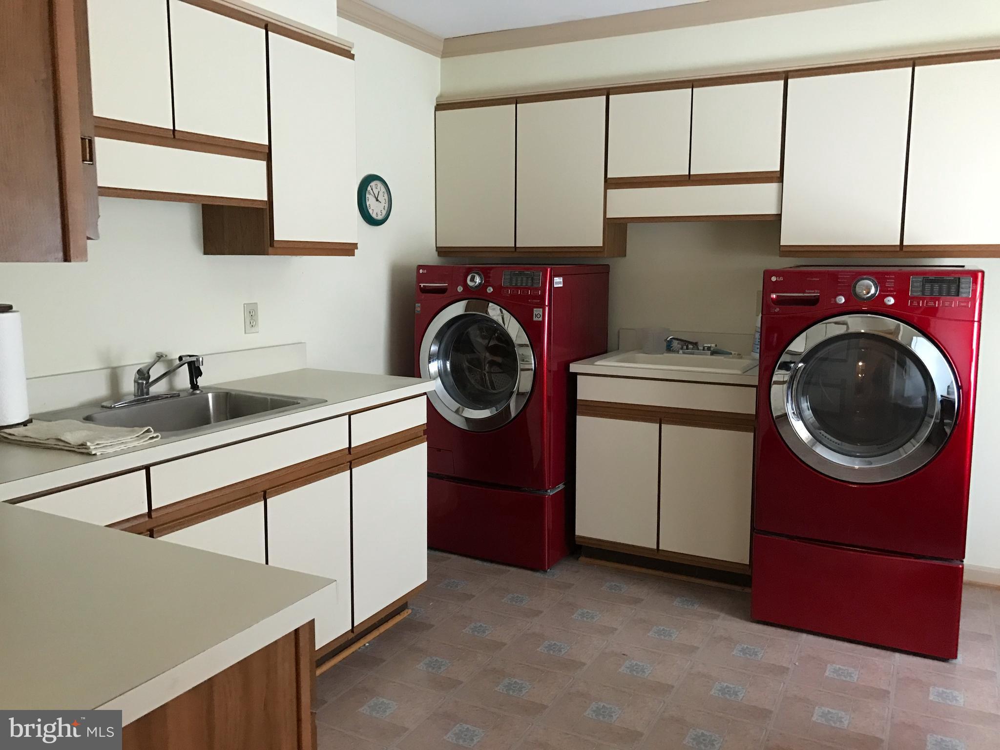 3121 Carroll Road Huntingtown, MD 20639 - Photo 11 of 26 a utility room with sink dryer and washer