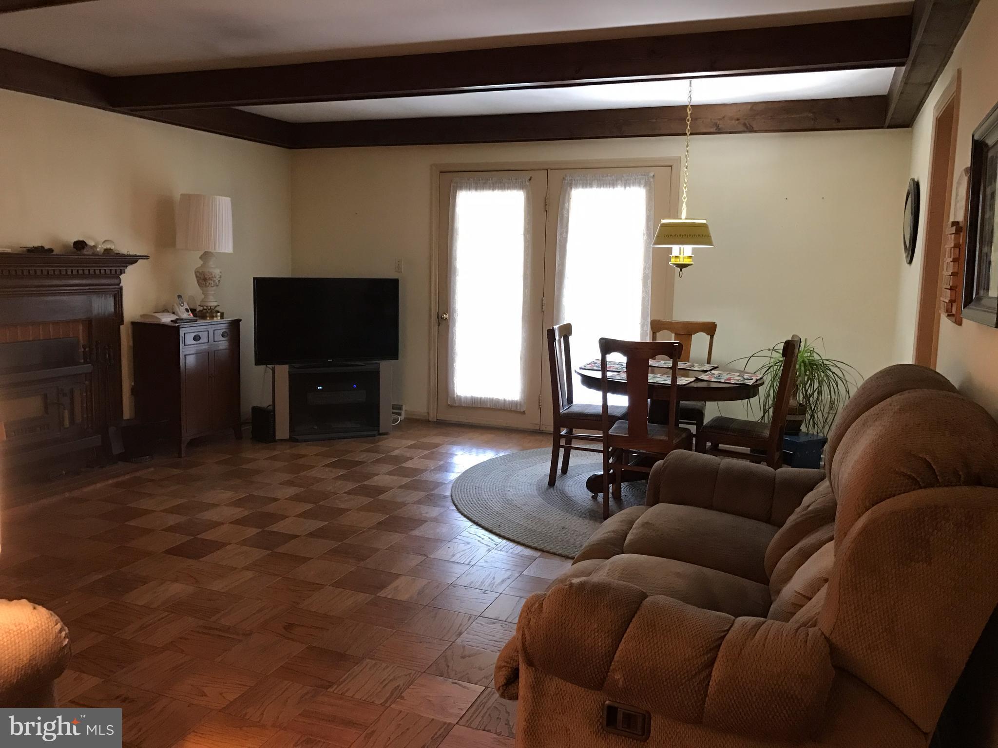 3121 Carroll Road Huntingtown, MD 20639 - Photo 12 of 26 a living room with furniture and a flat screen tv