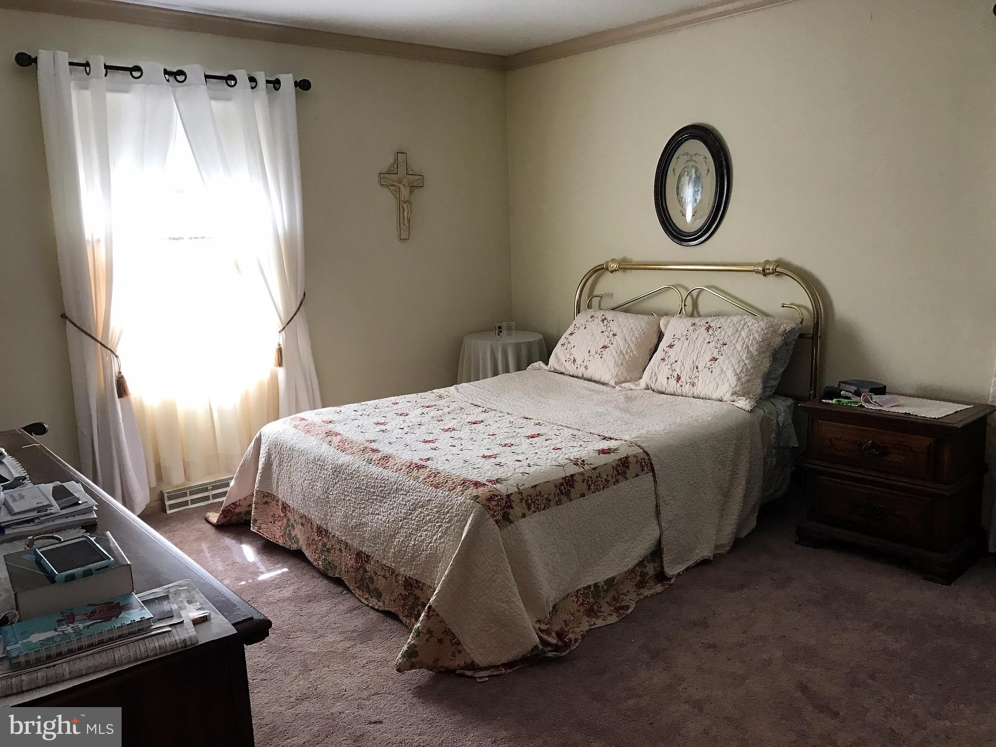 3121 Carroll Road Huntingtown, MD 20639 - Photo 20 of 26 a bedroom with a bed and a window