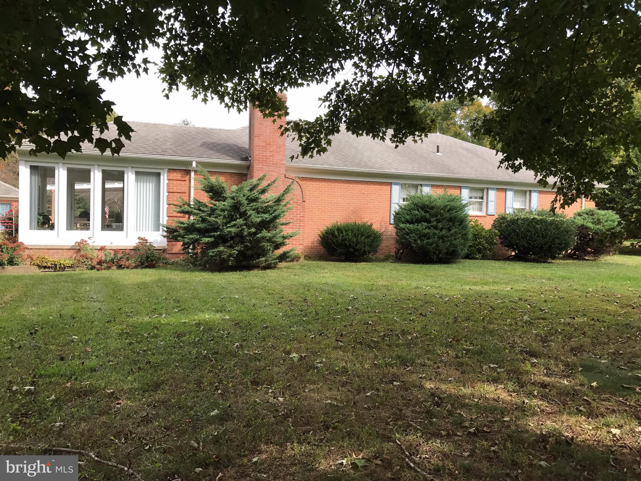 3121 Carroll Road Huntingtown, MD 20639 - Photo 24 of 26 a front view of house with yard and green space