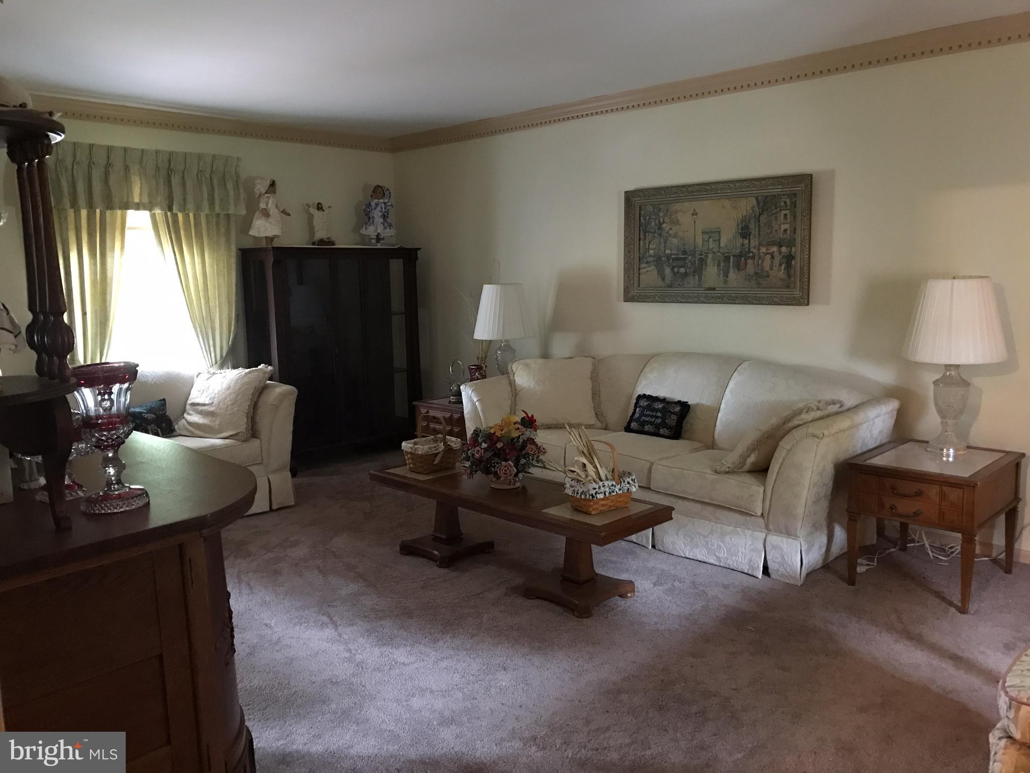 3121 Carroll Road Huntingtown, MD 20639 - Photo 9 of 26 a living room with furniture and a window