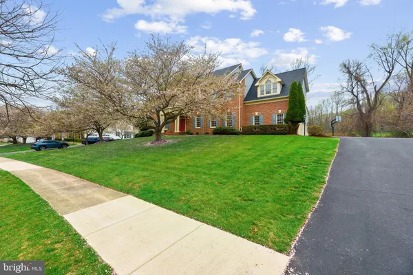 a kitchen with stainless steel appliances granite countertop a stove a refrigerator and a sink