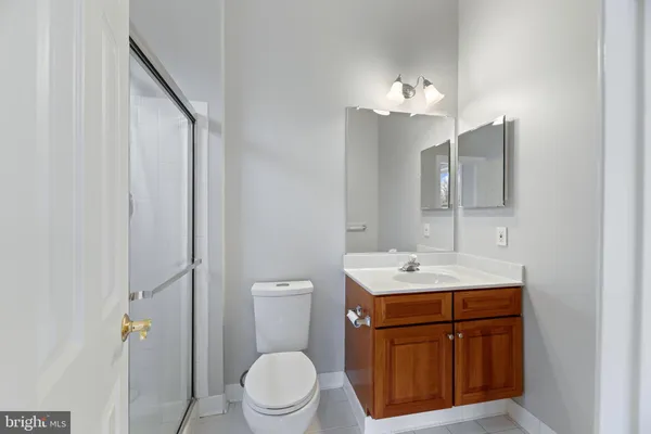 a picture of a bathroom with a shower