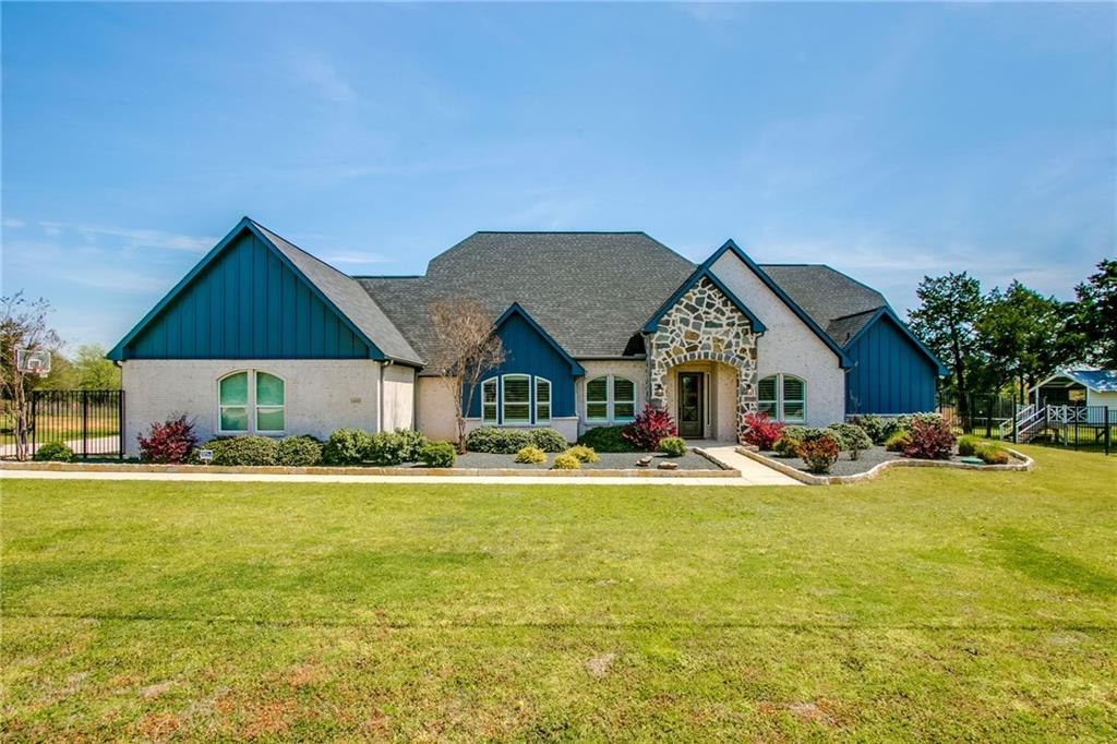 a view of house with outdoor space and swimming pool