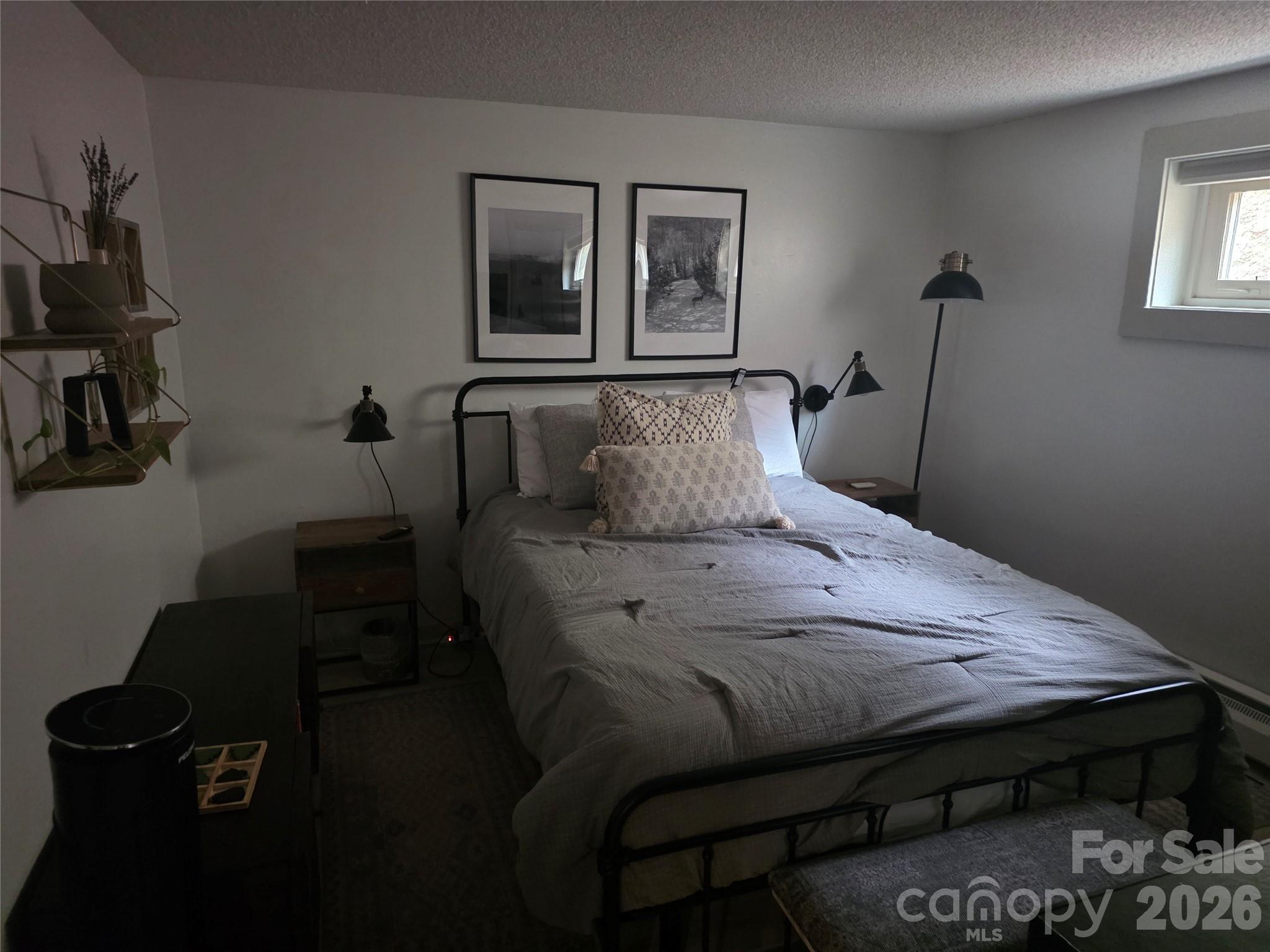 108 Northridge Road, Unit 1B Banner Elk, NC 28604 - Photo 15 of 34 a bedroom with a bed wooden floor and window