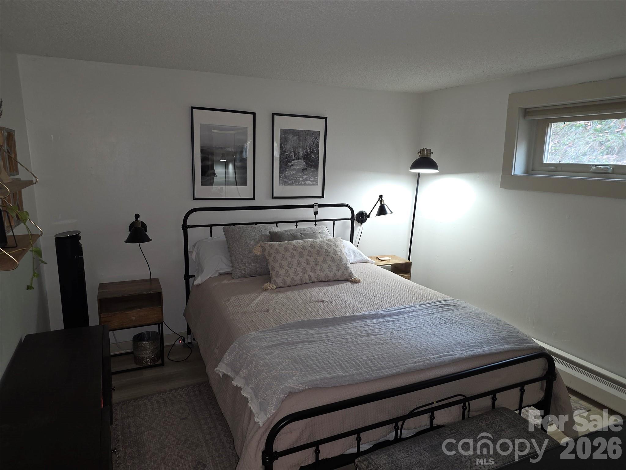 108 Northridge Road, Unit 1B Banner Elk, NC 28604 - Photo 16 of 34 a bedroom with a bed a desk and chair