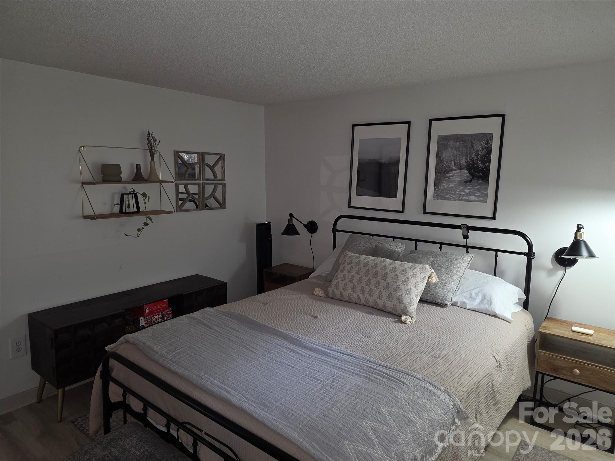 108 Northridge Road, Unit 1B Banner Elk, NC 28604 - Photo 17 of 34 a bedroom with a bed and wooden floor