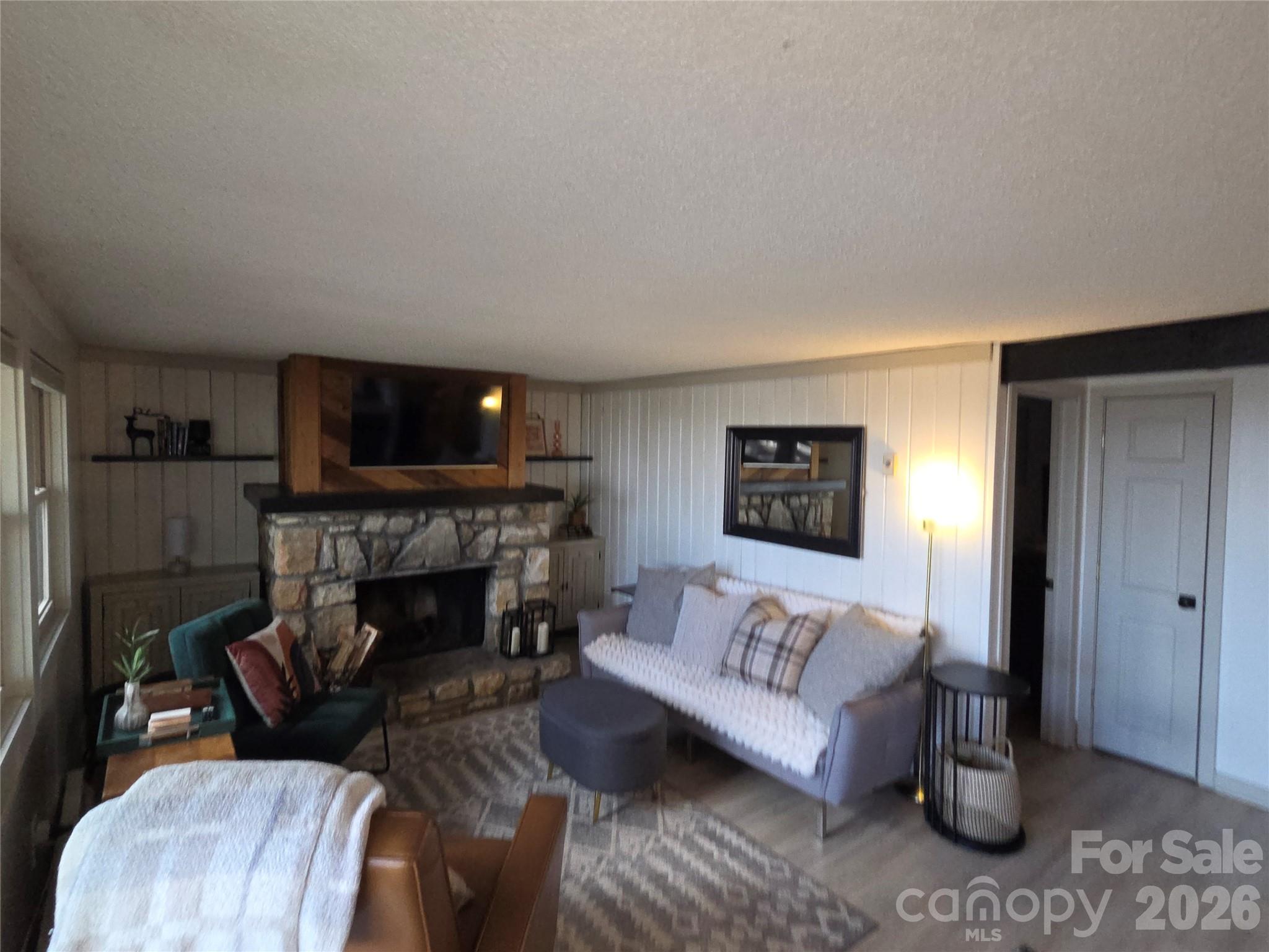 108 Northridge Road, Unit 1B Banner Elk, NC 28604 - Photo 9 of 34 a living room with furniture and a fireplace