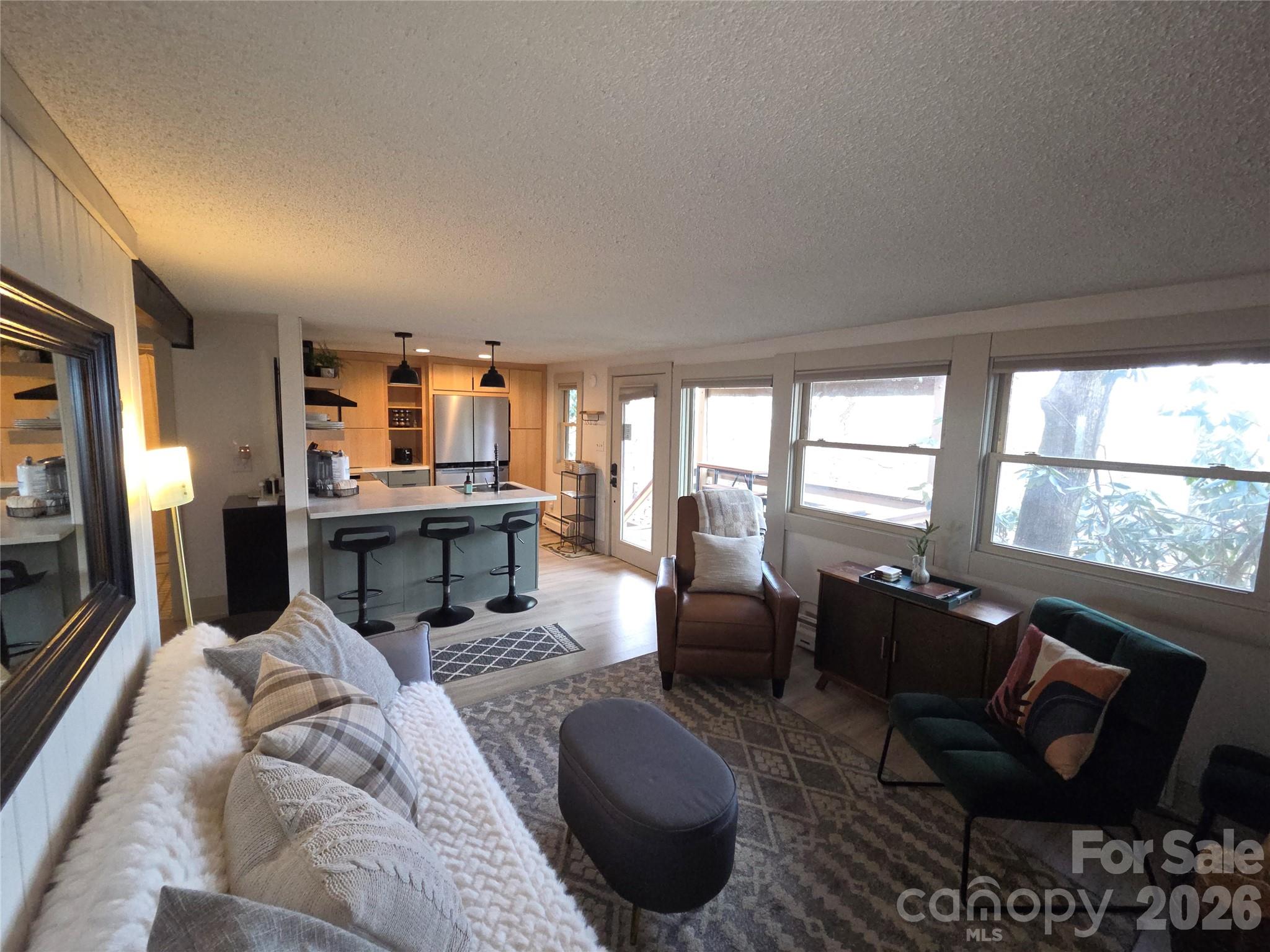 108 Northridge Road, Unit 1B Banner Elk, NC 28604 - Photo 10 of 34 a living room with furniture and a large window