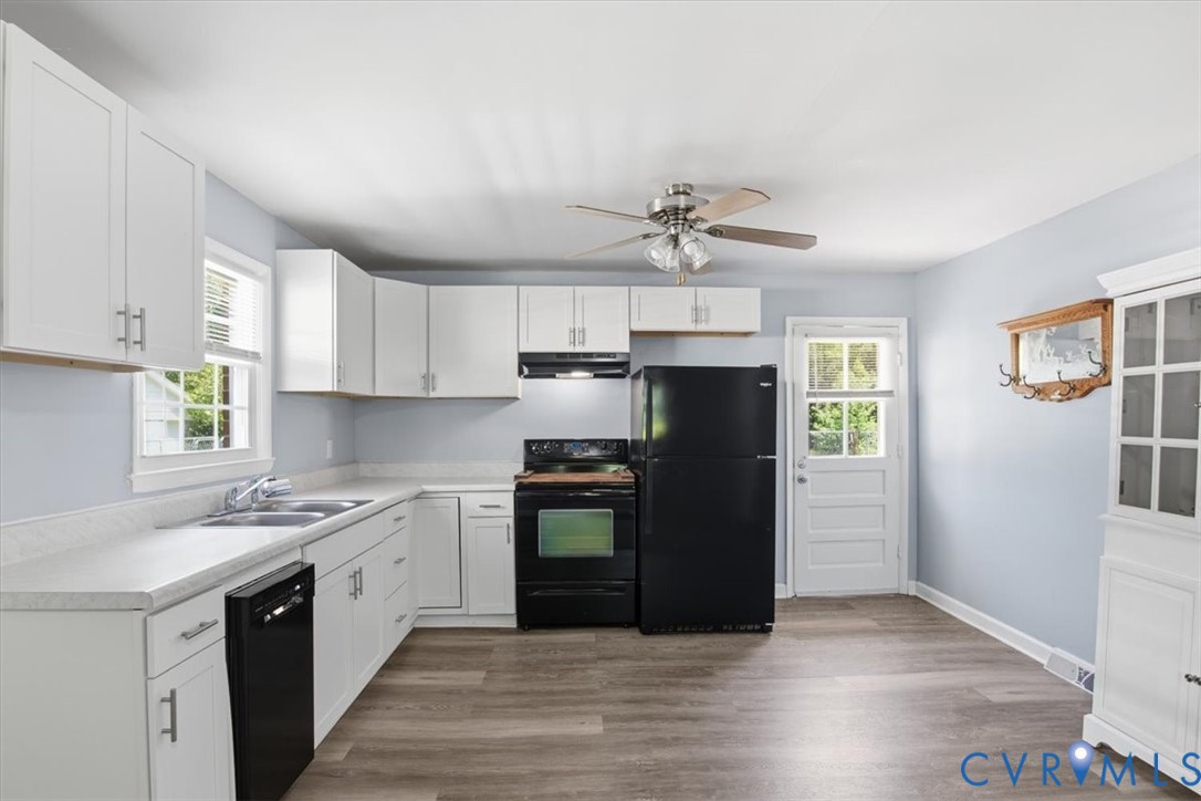 15503 Eppes Road Dewitt, VA 23840 - Photo 3 of 22 a kitchen with stainless steel appliances granite countertop a sink a stove a refrigerator cabinets and a window