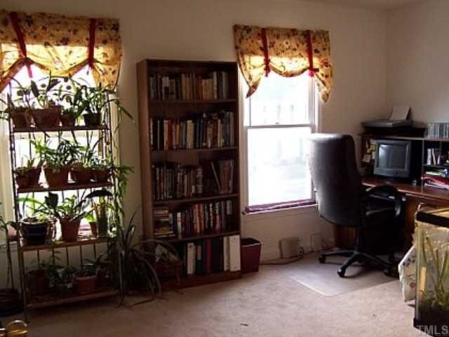 3346 Tarleton West Durham, NC 27713 - Photo 8 of 12 The downstairs bedroom is a great spot for the homeowner's orchids. It doubled as an office and guest bedroom. Bedroom