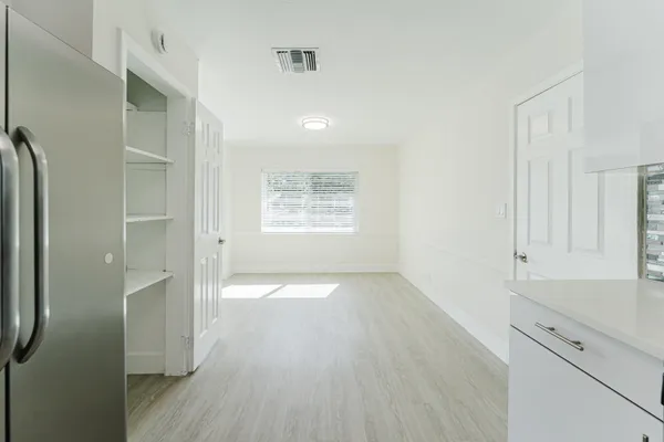 a kitchen with stainless steel appliances a stove sink microwave and refrigerator