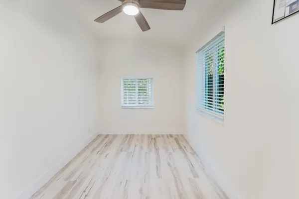 a view of room with window and ceiling fan