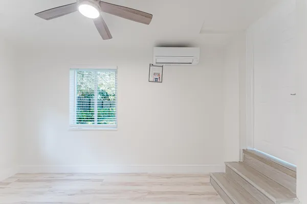 a bathroom with a toilet and shower