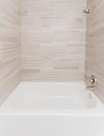a white toilet sitting next to a bathroom sink