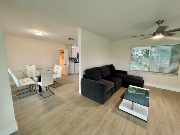 a living room with furniture and a window