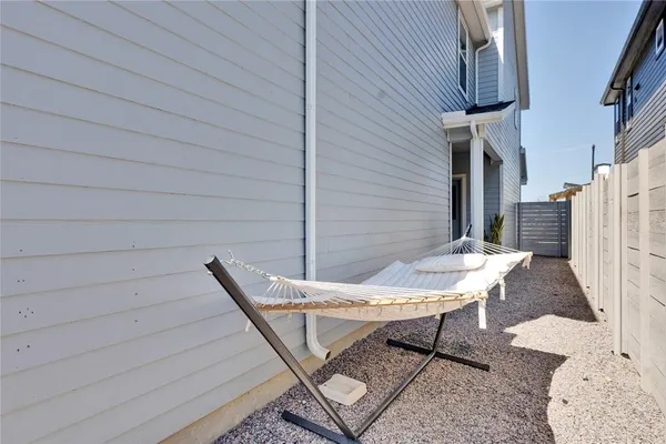 a view of a patio with a table and chairs