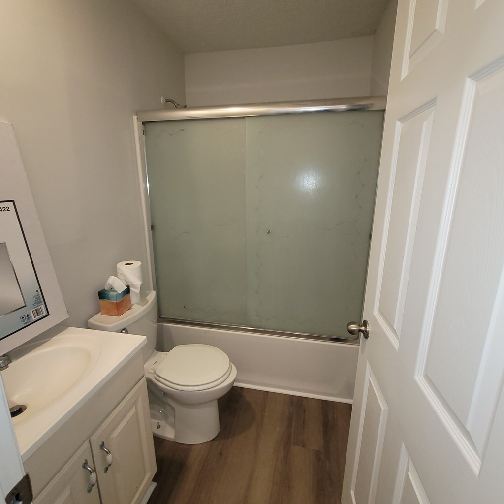2704 Lee Street, Unit B1 Columbus, GA 31903 - Photo 7 of 7 a bathroom with a granite countertop sink toilet and shower