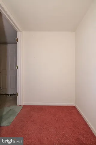 a room with a desk and a workspace