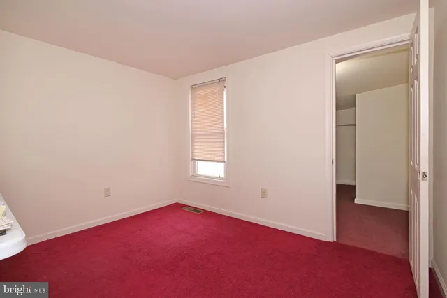 a view of an empty room with a workspace