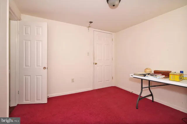 a bathroom with a toilet and a sink