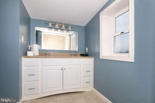 a front view of a house with lots of windows and sink